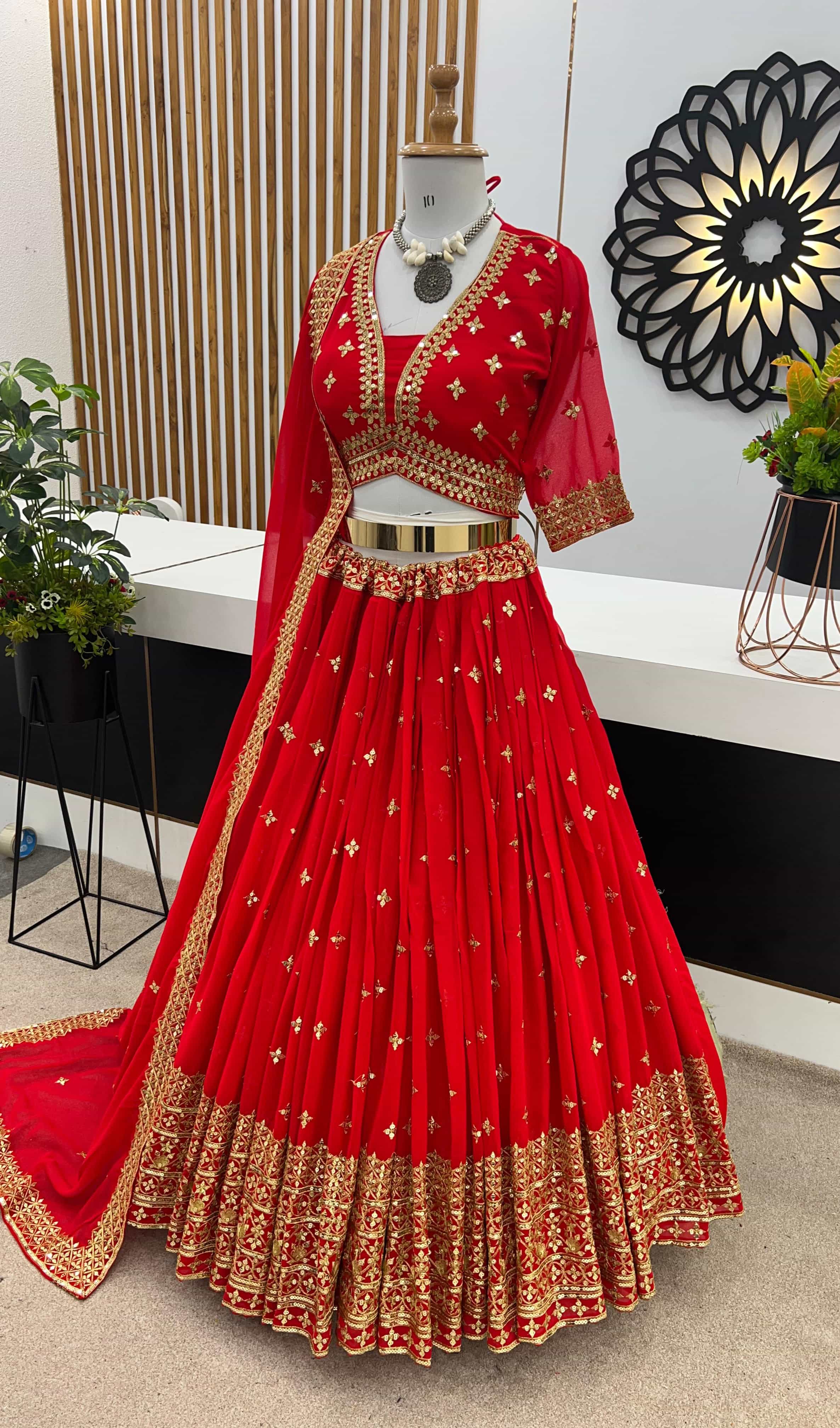 elegant red faux georgette lehenga choli with attached cups and sleeves