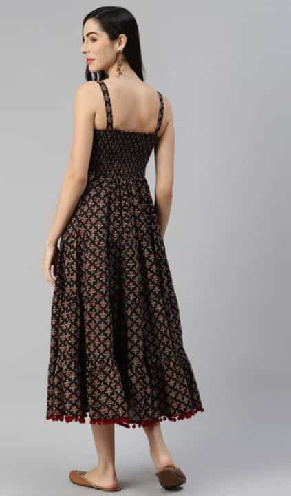 black sleeveless dress with flared hem