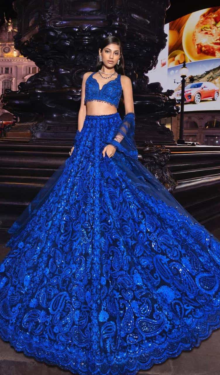 Navy blue lehenga set in faux georgette with sequined thread work, featuring a semi-stitched lehenga and unstitched choli