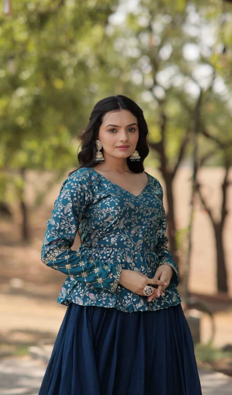 Full-stitched lehenga in shimmer Vichitra with cotton inner, zip closure, and a designer V-neck blouse with sequins