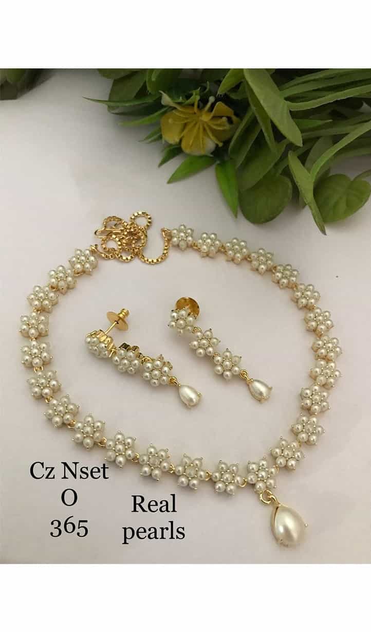 pearl jewelry set featuring a stunning necklace and matching earrings, showcasing the timeless beauty of pearls