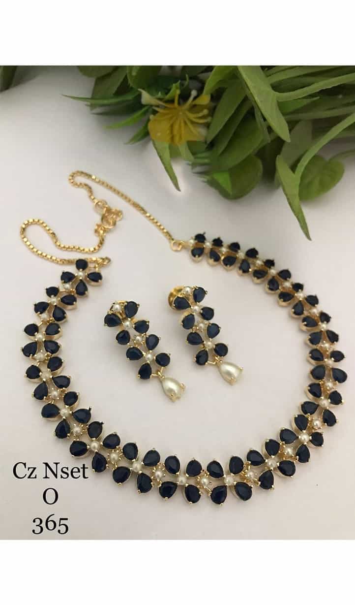 set of pearl earrings and necklace, showcasing the classic beauty and sophistication of these elegant gemstones