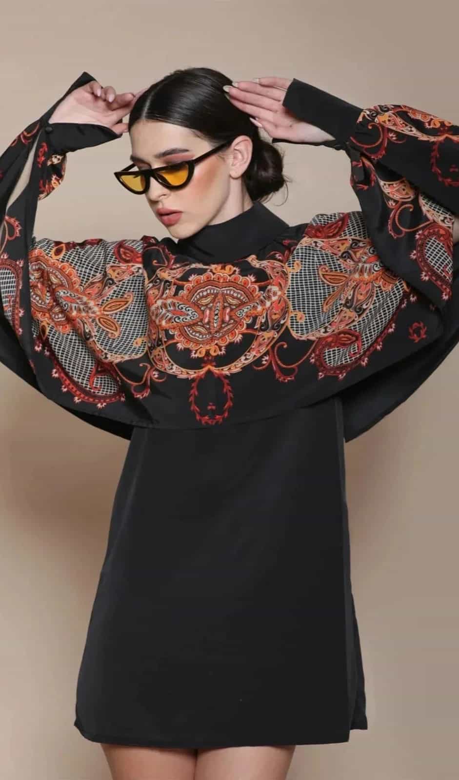 Classic black satin dress with a round neckline