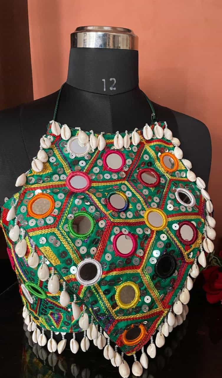 Beautiful sea green Navratri blouse with intricate stitching and latkan details