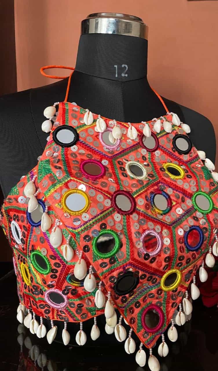 Vibrant orange party wear blouse with handmade hooks and padded fit