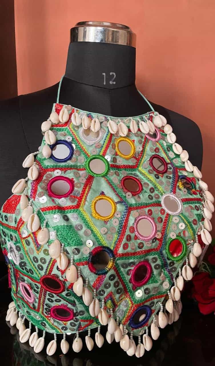 Elegant light cyan sleeveless blouse with kaudi work and handmade hooks