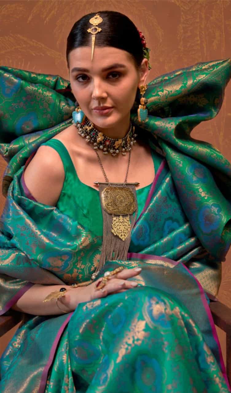 Rich teal handloom silk saree with intricate design