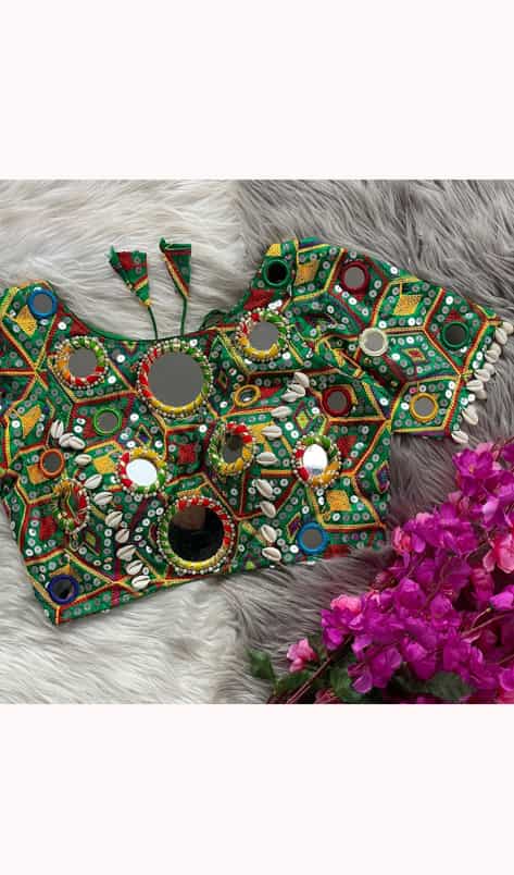 Adjustable designer dark green blouse with kaudi work and rich stitching
