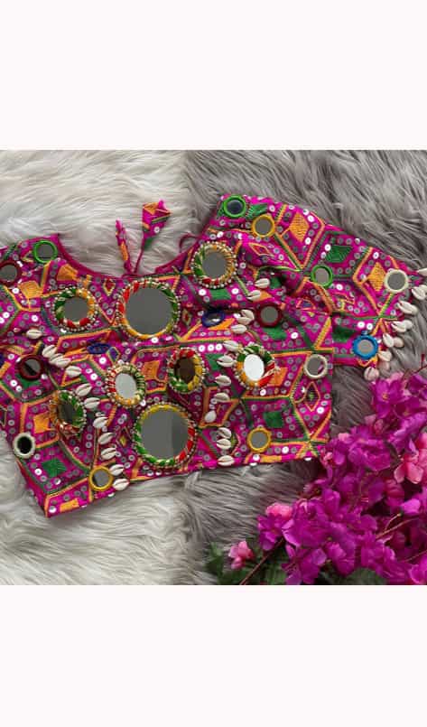 Navratri and party wear dark pink blouse with decorative latkans and stitching