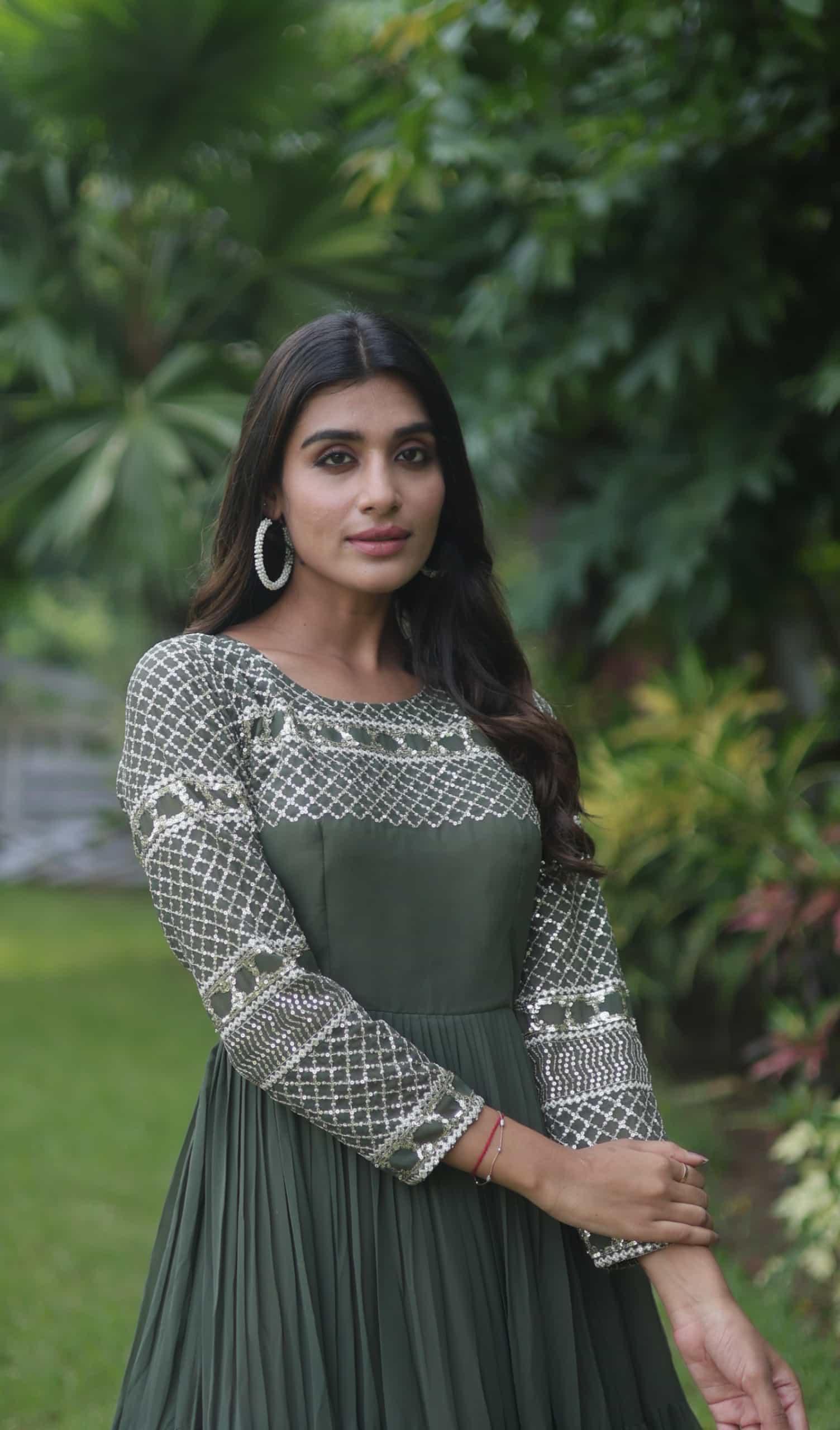 Mehendi green gown with zari sequins embroidery and full sleeves