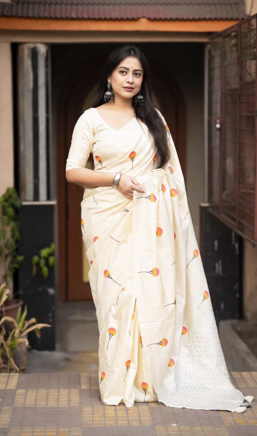 Cream soft silk saree with woven rose design