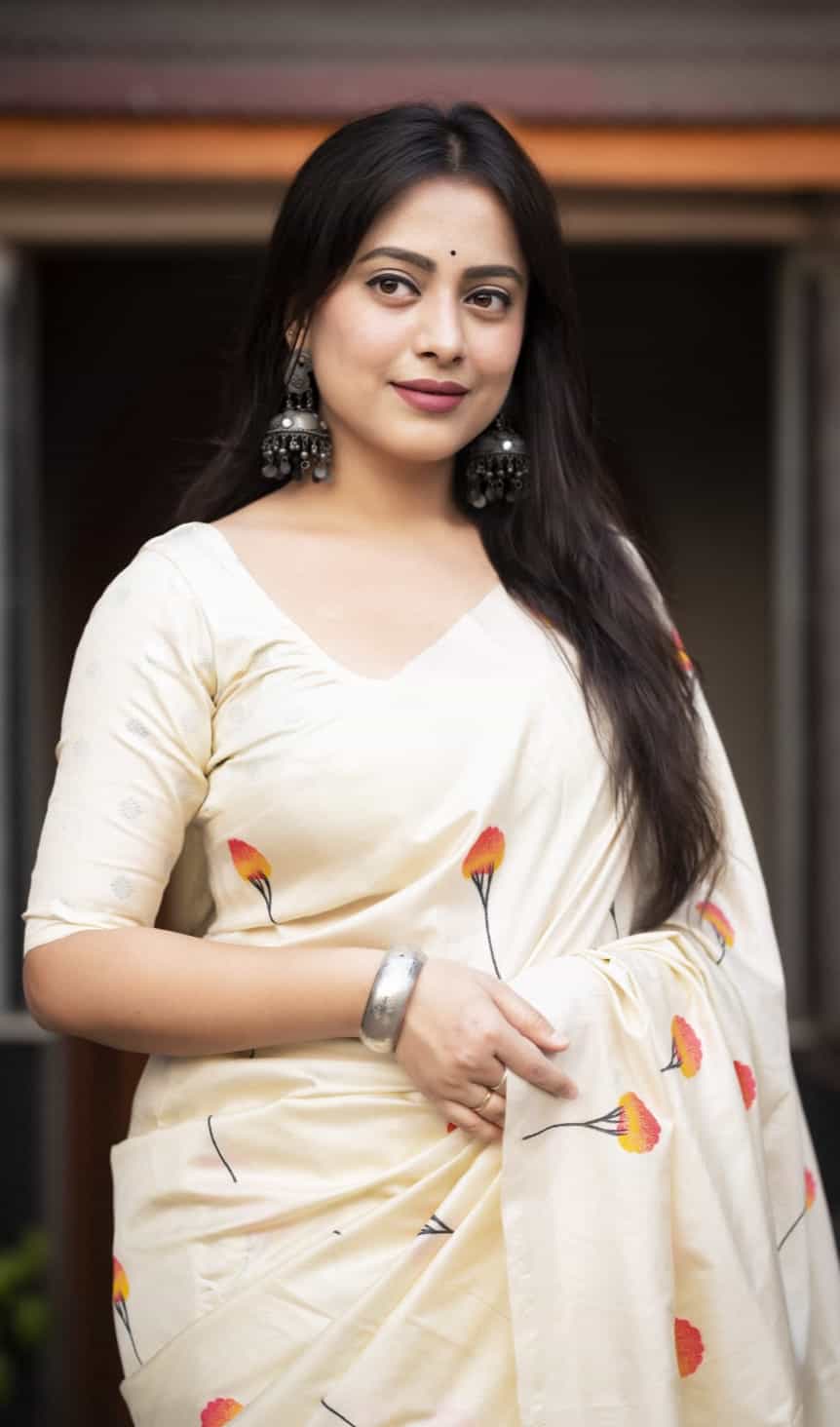 Graceful floral woven silk saree with silver accents