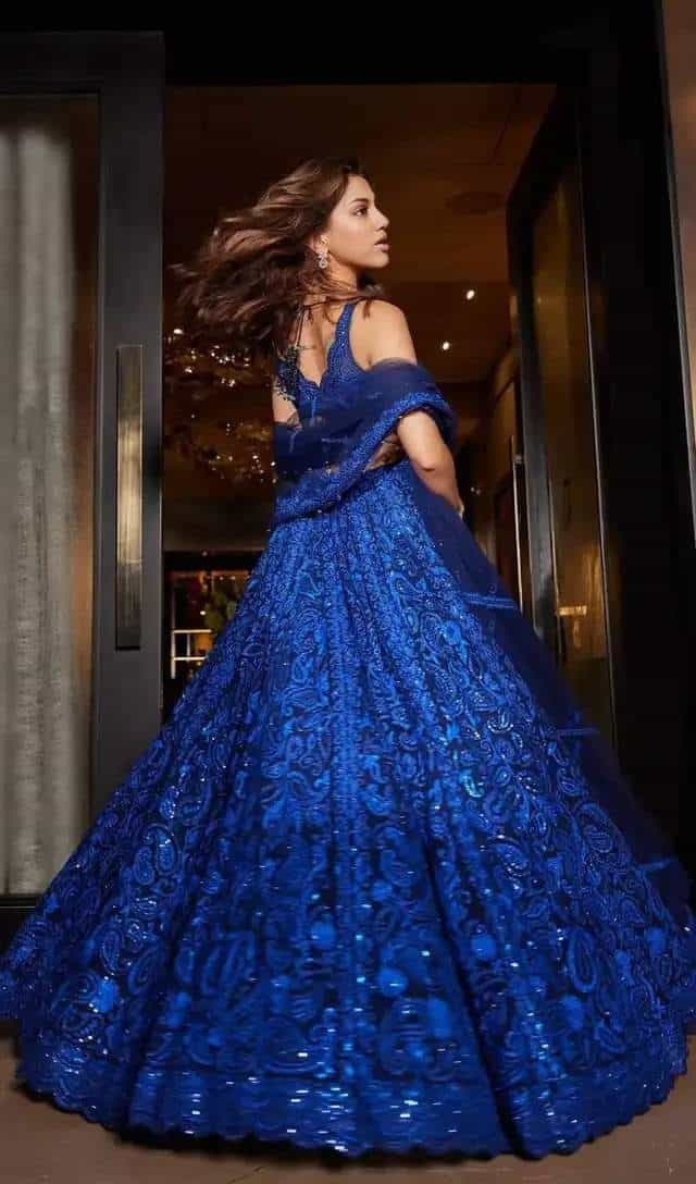 Navy blue faux georgette lehenga set with sequined thread detailing, featuring a semi-stitched lehenga, unstitched choli, and butterfly net dupatta